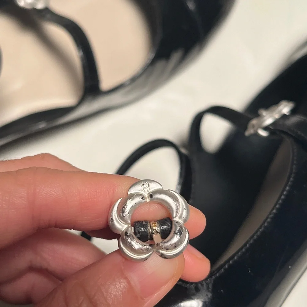 CHANEL Black Patent Leather Flats with Silver Floral Accents - Picture 9 of 14